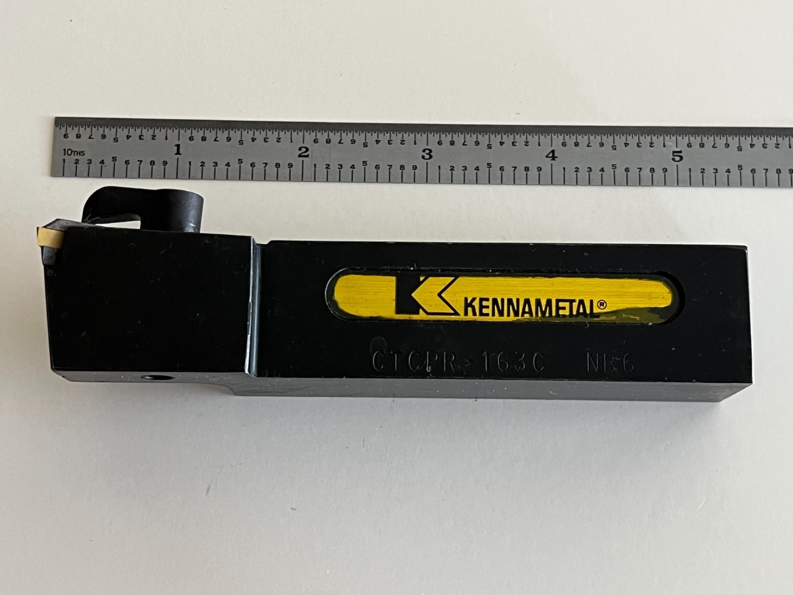 KENNAMETAL INDEXABLE GROOVE CTCPR-163C TOOL USES TPG 321 SERIES INSERT AS SHOWN.