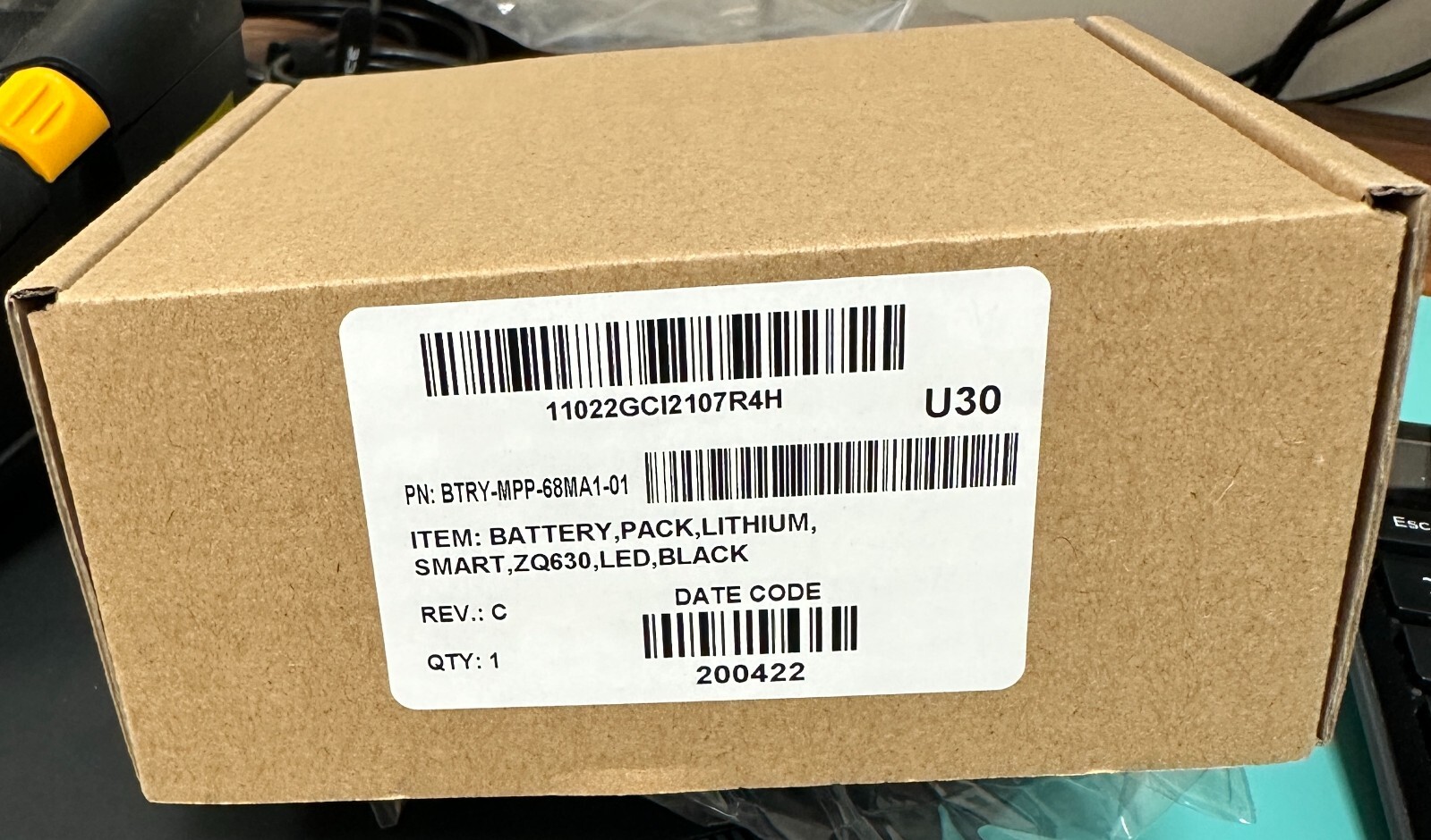 NEW SEAL Printer Battery Pack Zebra ZQ630+ BTRY-MPP-68MA1-01 and its charger.