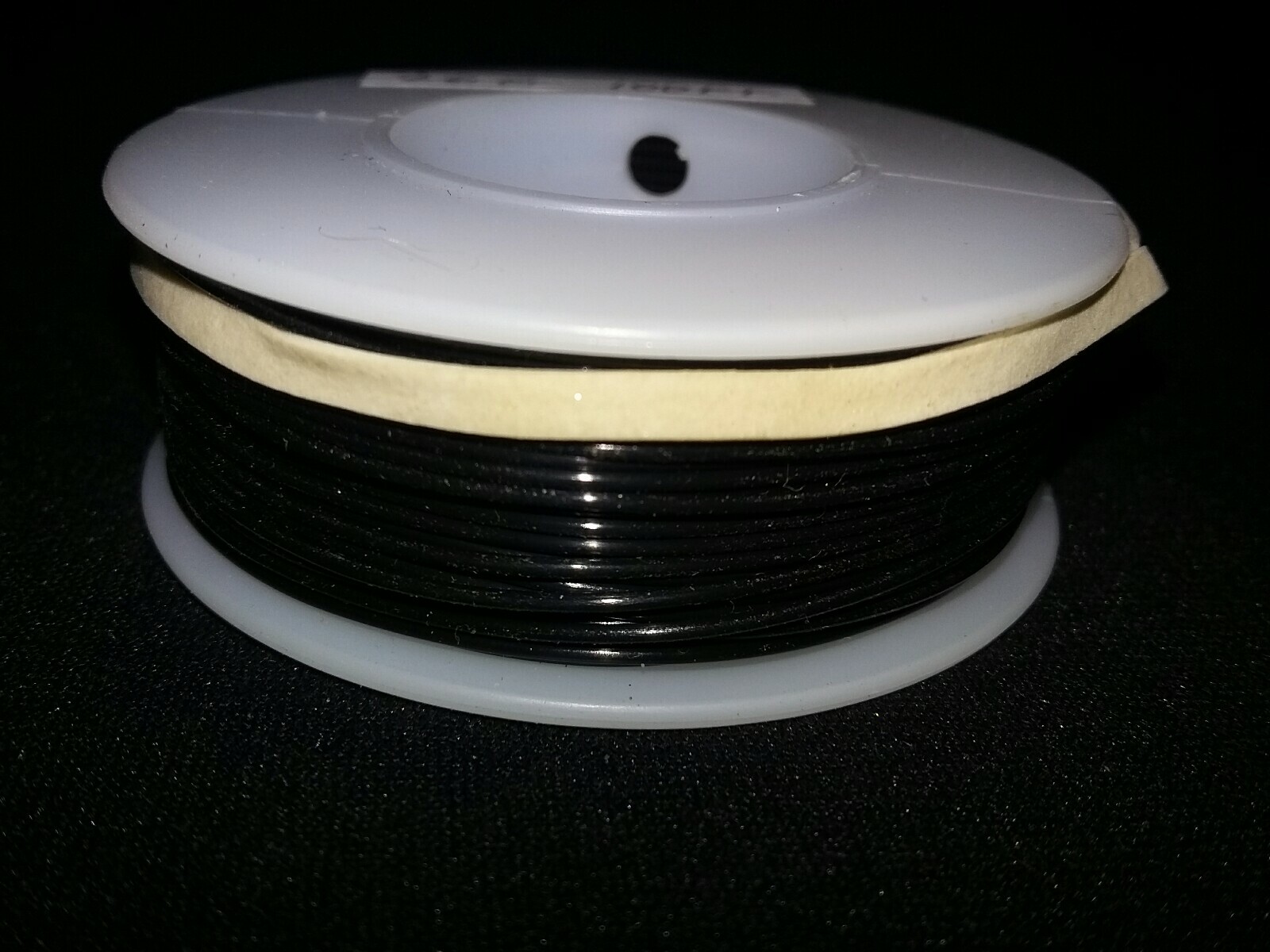 26 GA. Solid Strand Type “E” Teflon Black M16878/4 200°C @ 600V 100 ft. spool